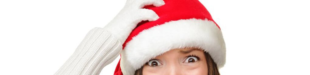 woman in a santa hat stressed over holiday accidents