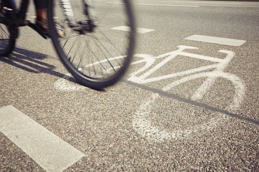 cyclist riding in a bicycle lane