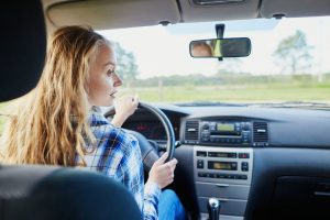 woman driving a car and looking to the right