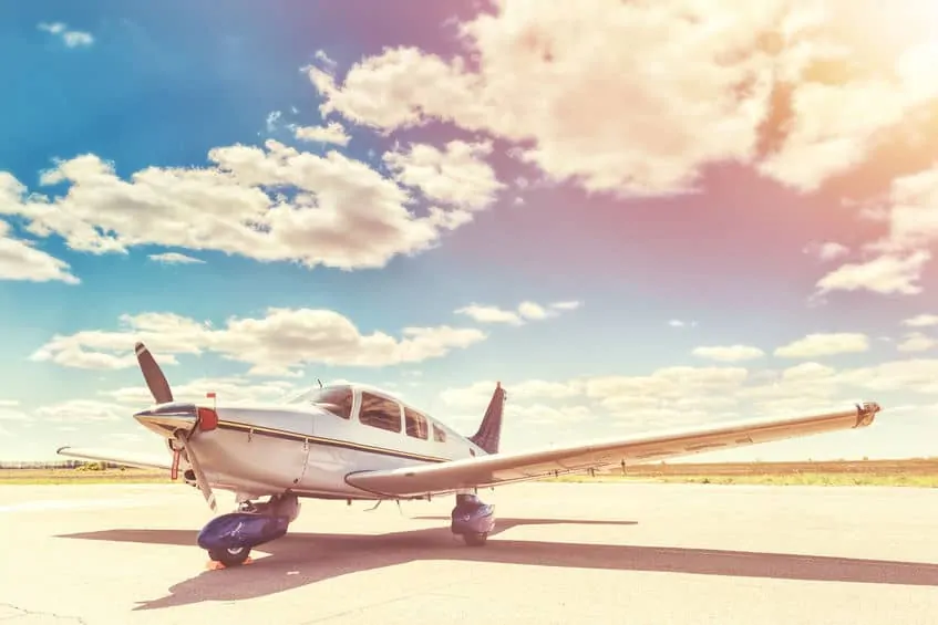 single engine airplane parked at the airport