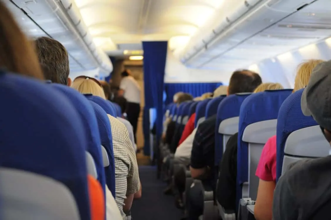 the view from a passenger's perspective looking down the middle of an airplane