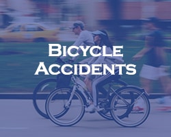 Bicycle Accidents - blue overlay on two people riding bikes on the street with a car in the background