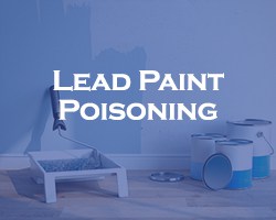 Lead Paint Poisoning - blue over a partially painted wall with painting supplies below