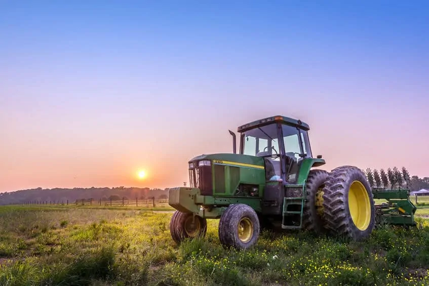Farm Tractor in a field on a Maryland Farm at sunset