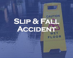 Slip And Fall Accident - blue overlay on a caution wet floor sign with a wet floor