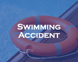 swimming accident - blue over a PFD, flotation device, on the edge of a swimming pool