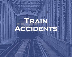 Train Accidents - blue over a head on view of a train on railroad tracks