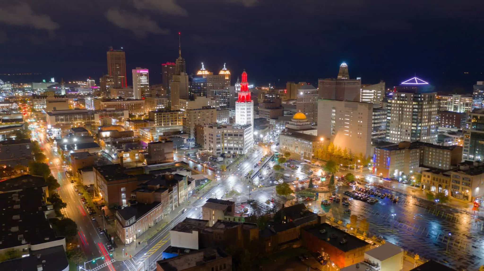 The buildings are illuminated before sunrise in the urban core of Buffalo New York